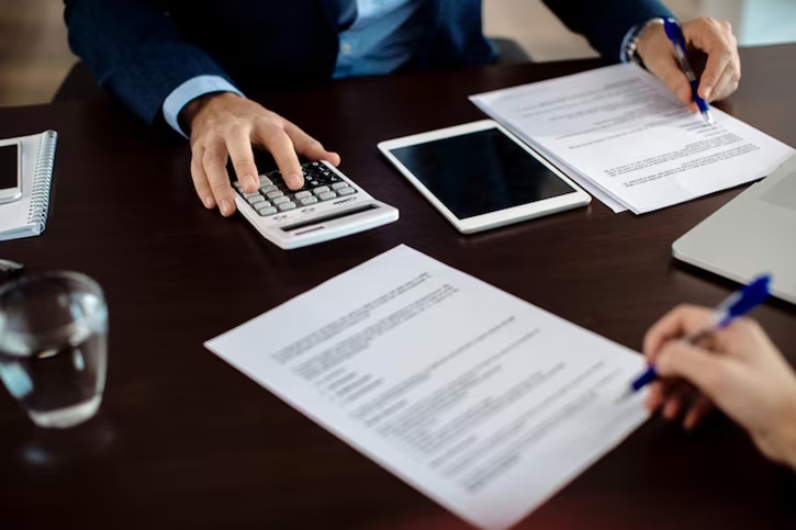Loan documents and calculator.